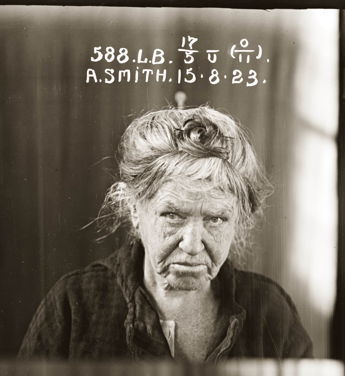 Mugshot of 588 Agnes Smith taken 15 August 1923. Three views: face, profile, full length.